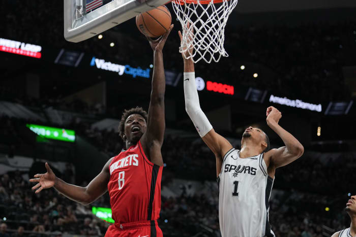 Rockets forward Jae'Sean Tate shoots in front of San Antonio Spurs center Victor Wembanyama (1) in the second half at the Frost Bank Center.